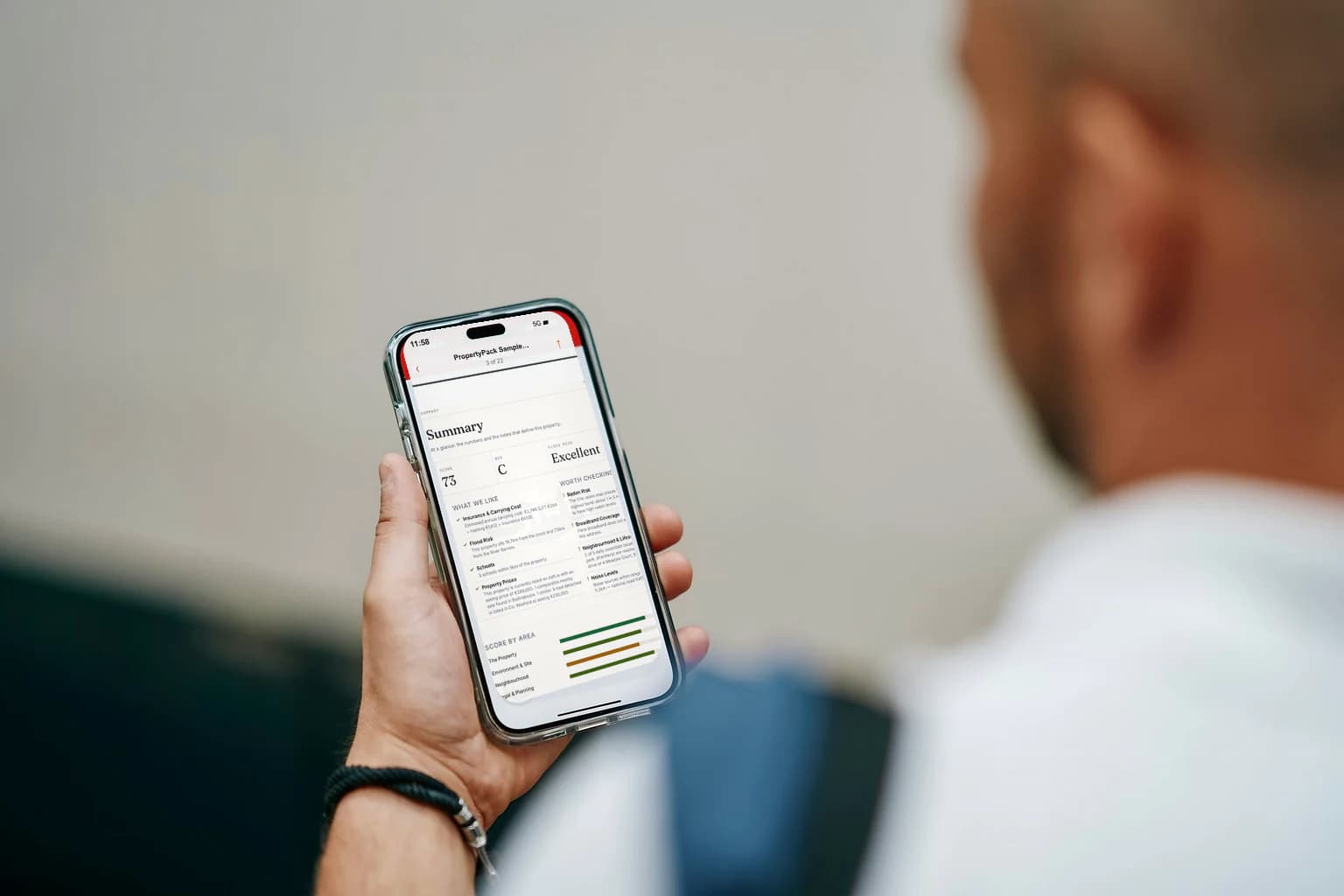 Illustrative Irish buyer reading a property report on a phone